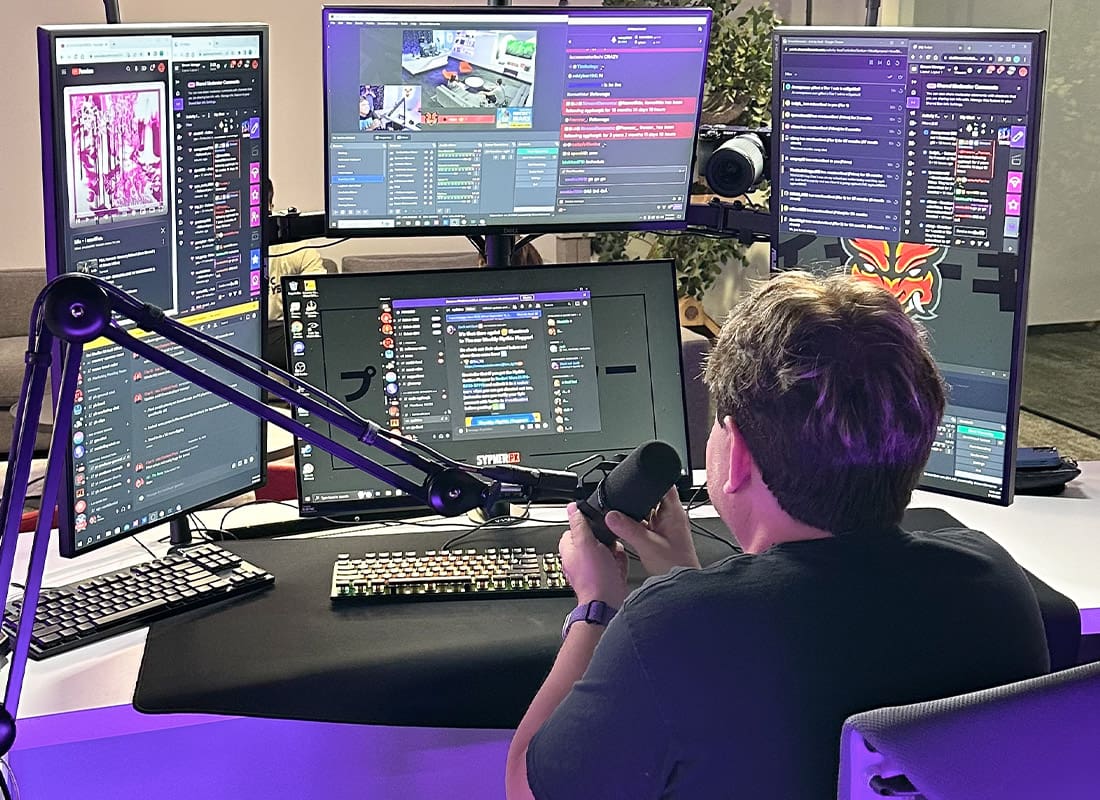 Insurance by Industry - Man Recording a Stream With Four Monitors in His Home
